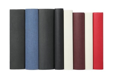 Photo of Row of hardcover books isolated on white
