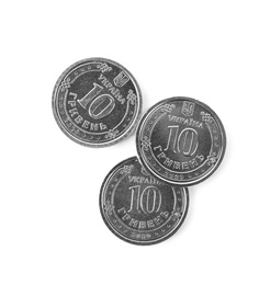 Photo of Ukrainian coins isolated on white, top view. National currency