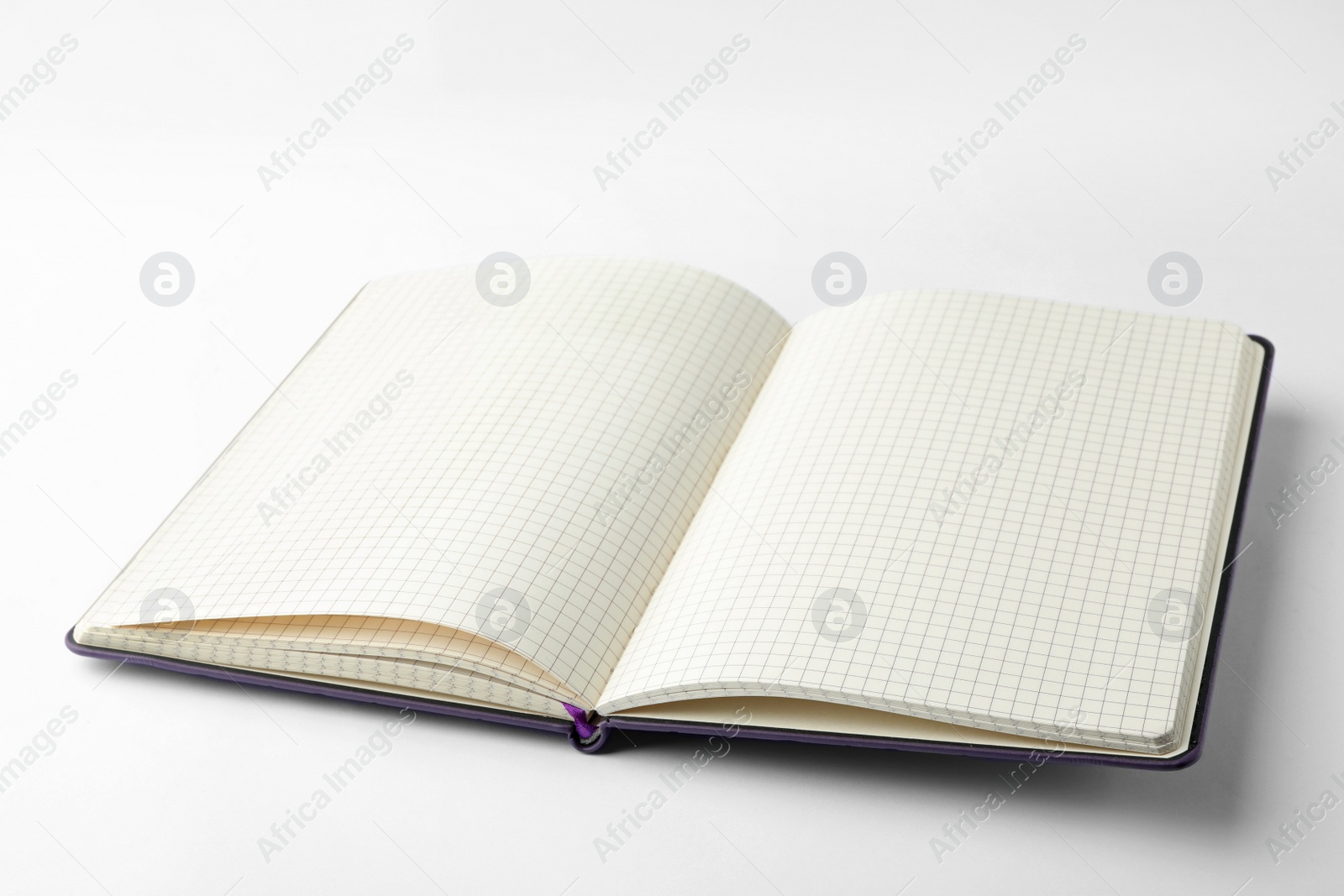 Photo of Stylish open notebook with blank sheets isolated on white