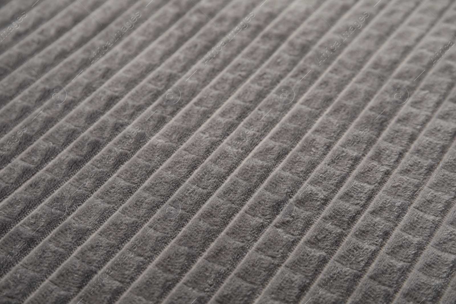 Photo of Soft warm grey plaid as background, closeup