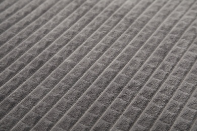 Soft warm grey plaid as background, closeup