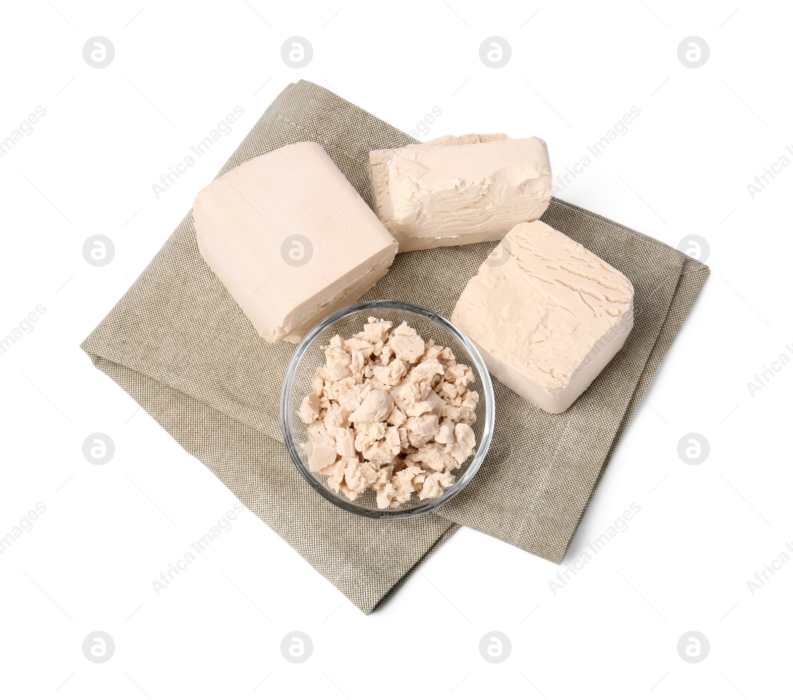 Photo of Pieces of compressed yeast isolated on white, top view