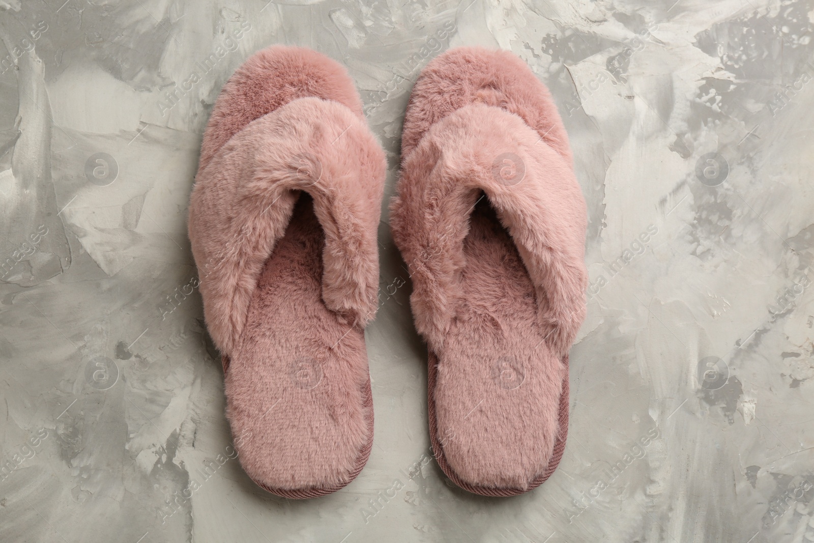 Photo of Pair of stylish soft slippers on grey background, flat lay