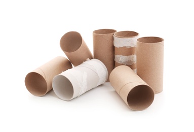 Empty paper toilet rolls on white background