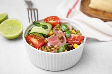 Photo of Bowl of salad with mung beans on white table