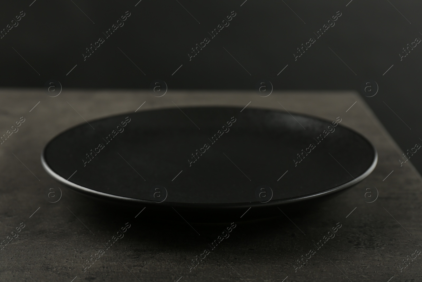 Photo of Beautiful ceramic plate on gray table, closeup