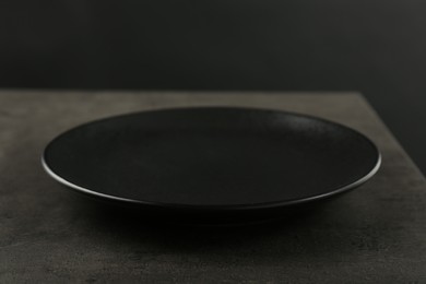 Beautiful ceramic plate on gray table, closeup