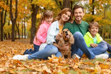 Photo of Happy family with children and dog in park. Autumn walk