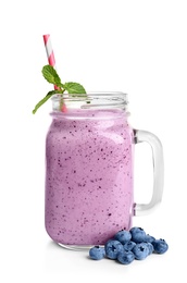 Photo of Tasty blueberry smoothie in mason jar on white background