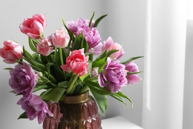 Photo of Beautiful bouquet of colorful tulip flowers indoors, closeup. Space for text