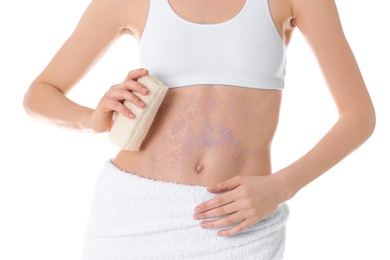Photo of Young woman applying natural scrub on her belly against white background