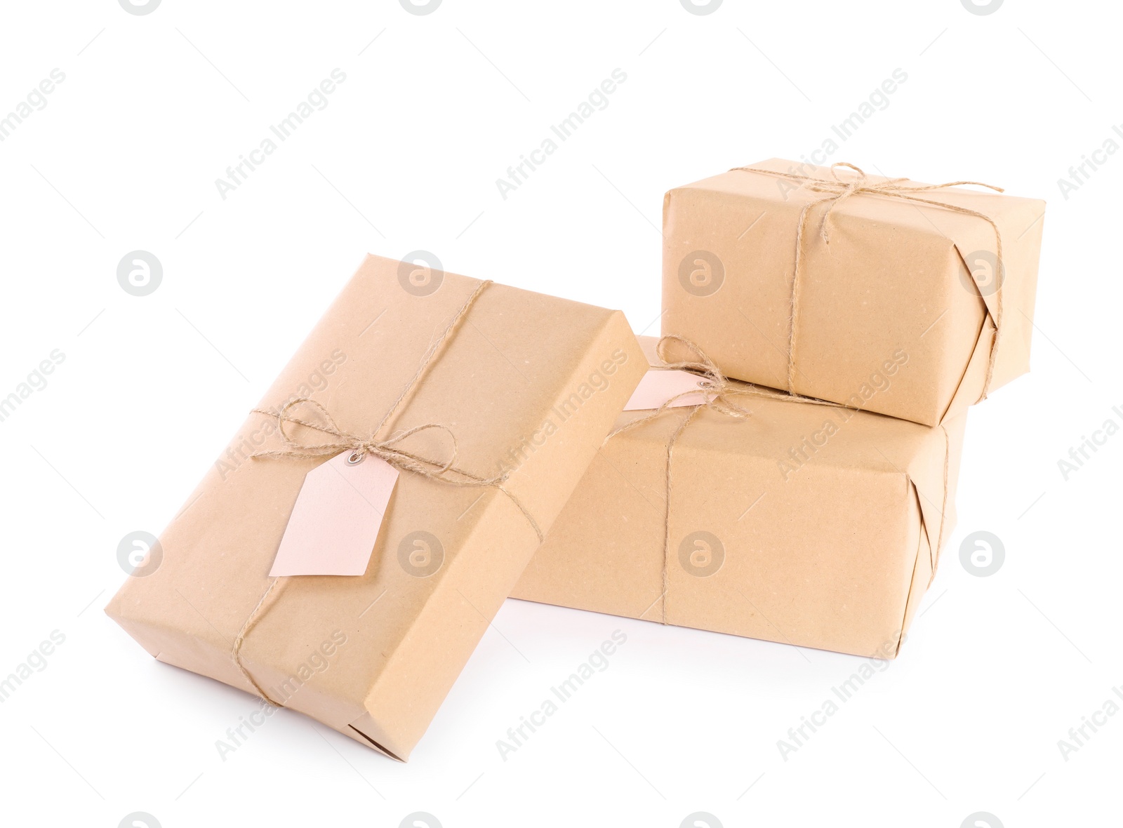 Photo of Parcels wrapped in kraft paper on white background