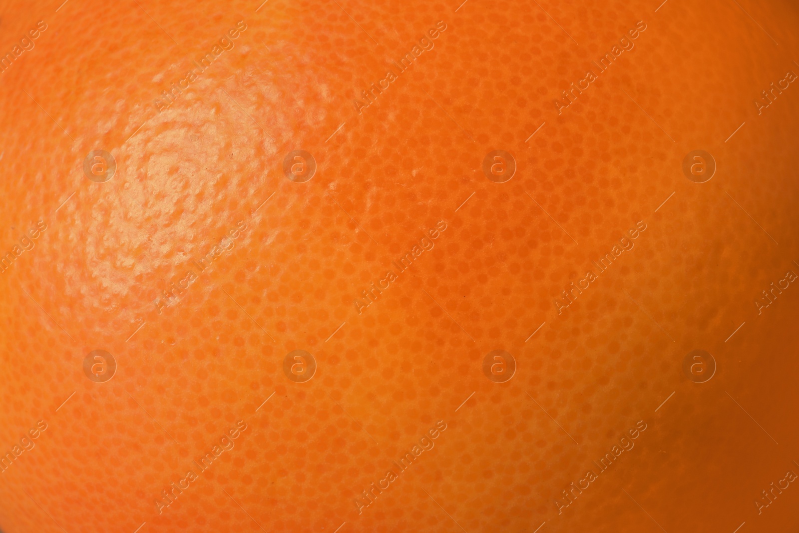 Photo of Ripe orange as background, closeup. Citrus fruit