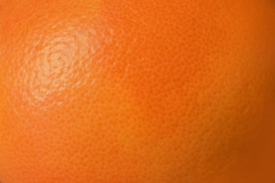 Photo of Ripe orange as background, closeup. Citrus fruit