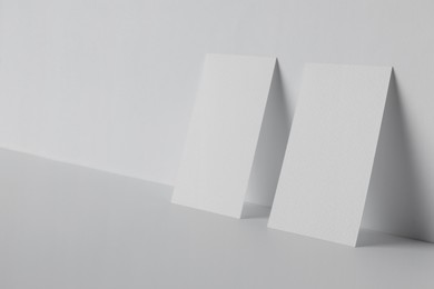 Blank business cards on white background. Mockup for design