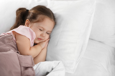 Photo of Cute little girl sleeping at home, space for text. Bedtime schedule