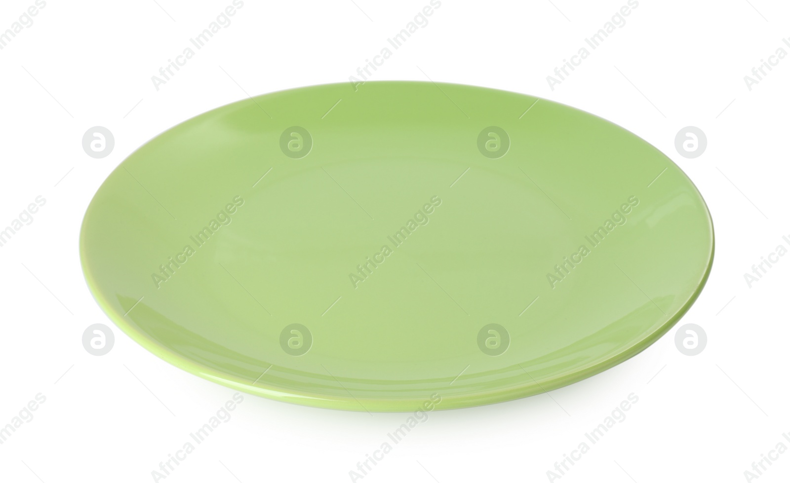 Photo of One beautiful green plate isolated on white