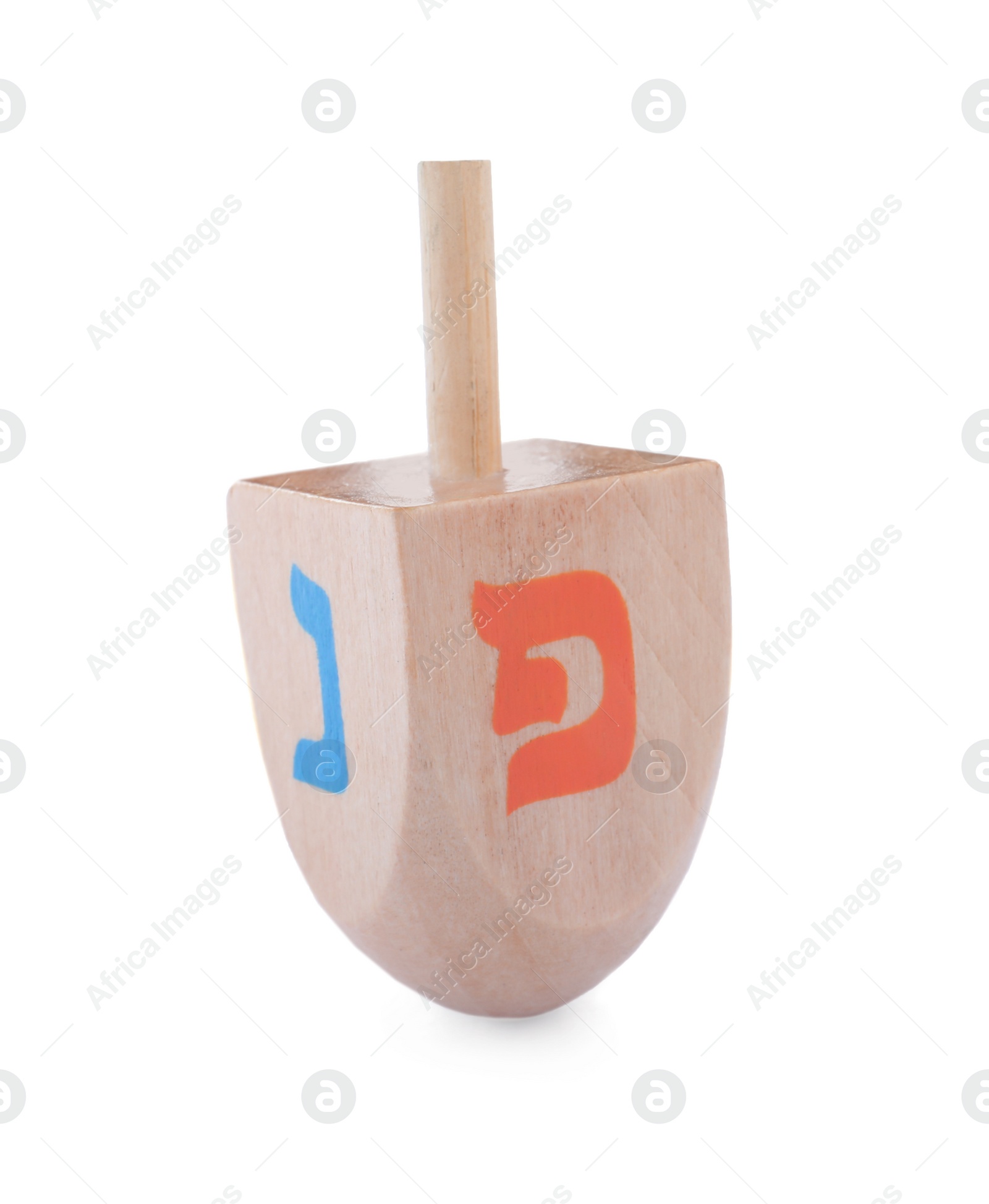 Photo of Wooden Hanukkah traditional dreidel with letters Nun and Pe isolated on white