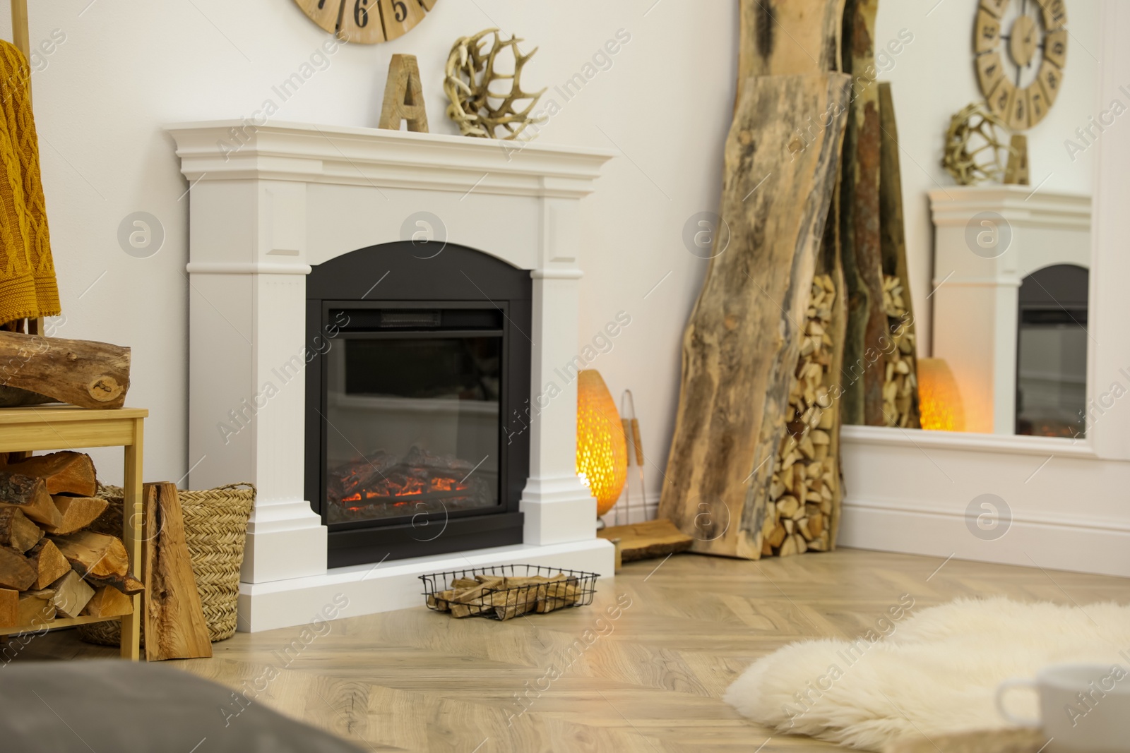 Photo of Elegant fireplace with burning flame in contemporary room interior