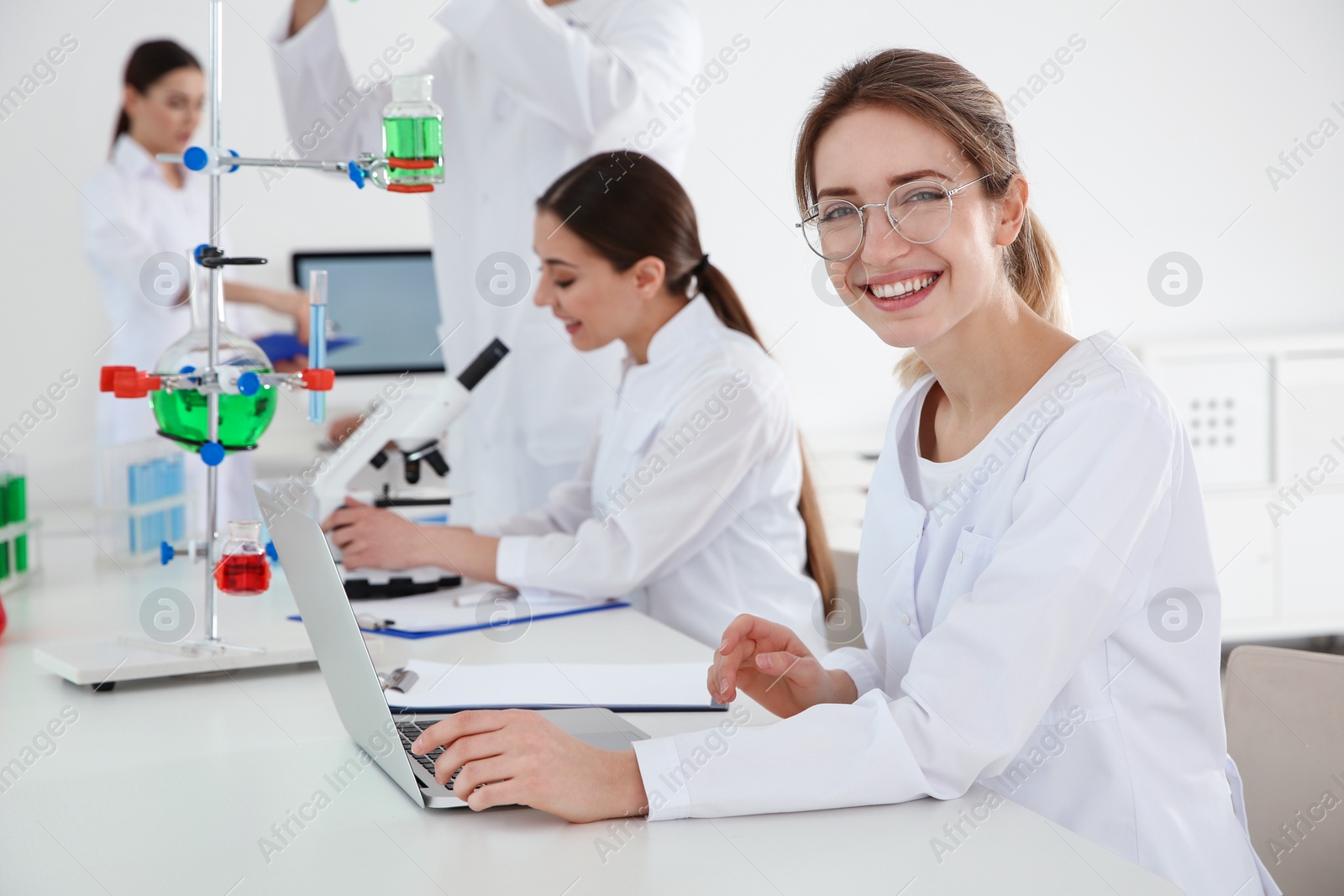 Photo of Medical students working in modern scientific laboratory