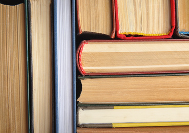 Photo of Many different hardcover books as background, top view