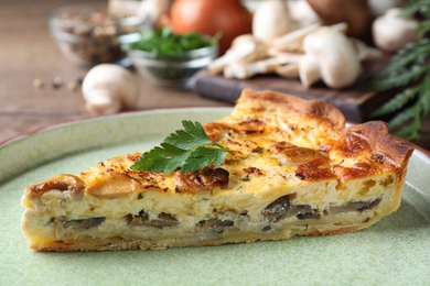 Photo of Delicious pie with mushrooms and cheese on plate, closeup