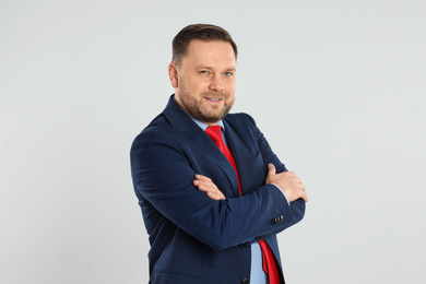 Photo of Portrait of happy mature man on light grey background