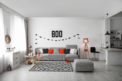 Photo of Modern room decorated for Halloween. Festive interior