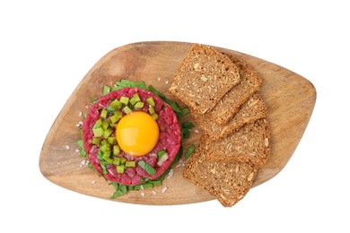 Photo of Tasty beef steak tartare served with yolk, pickled cucumber and sliced bread isolated on white, top view