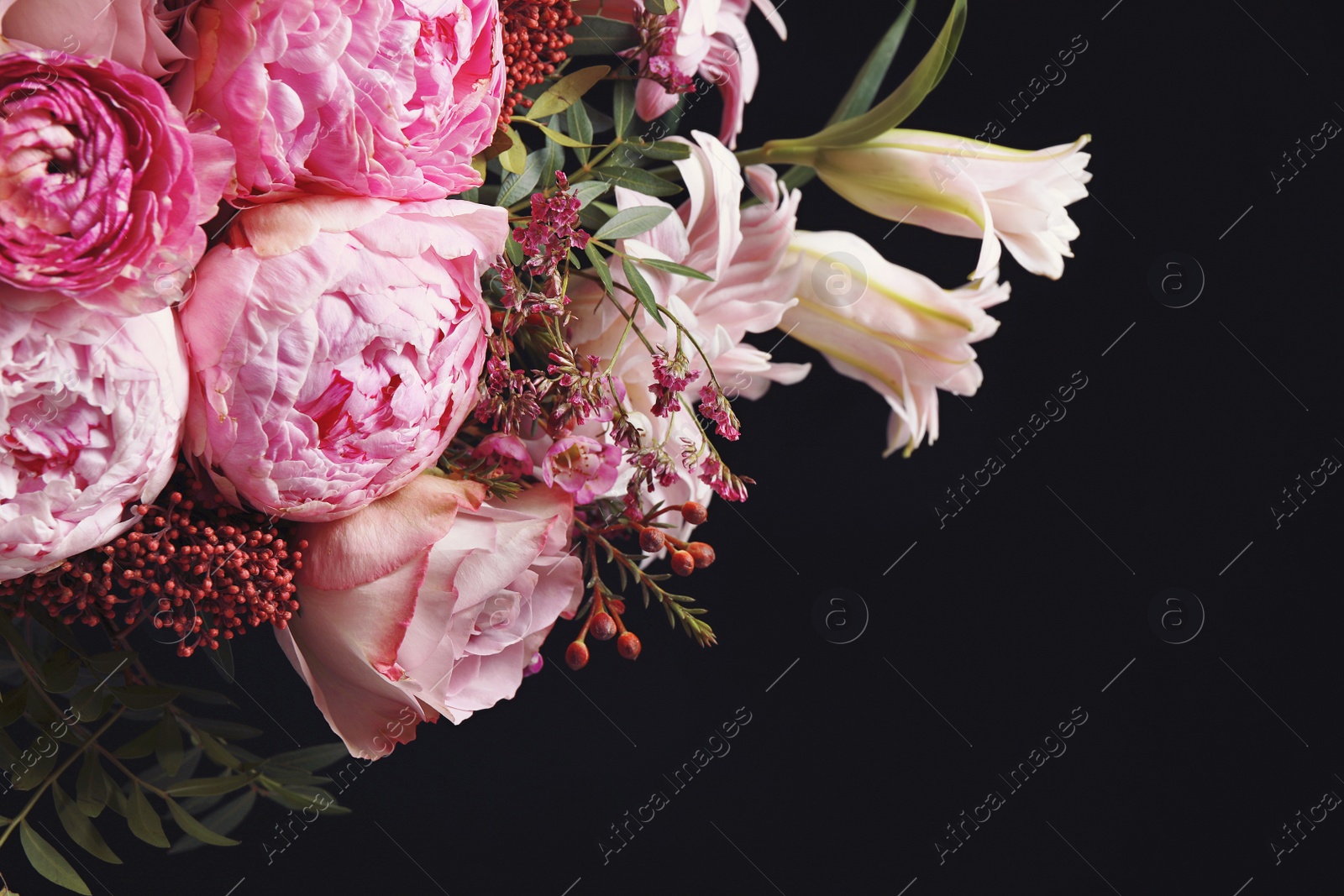 Photo of Beautiful bouquet of different flowers on black background. Floral card design with dark vintage effect