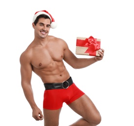 Photo of Sexy shirtless Santa Claus with gift on white background