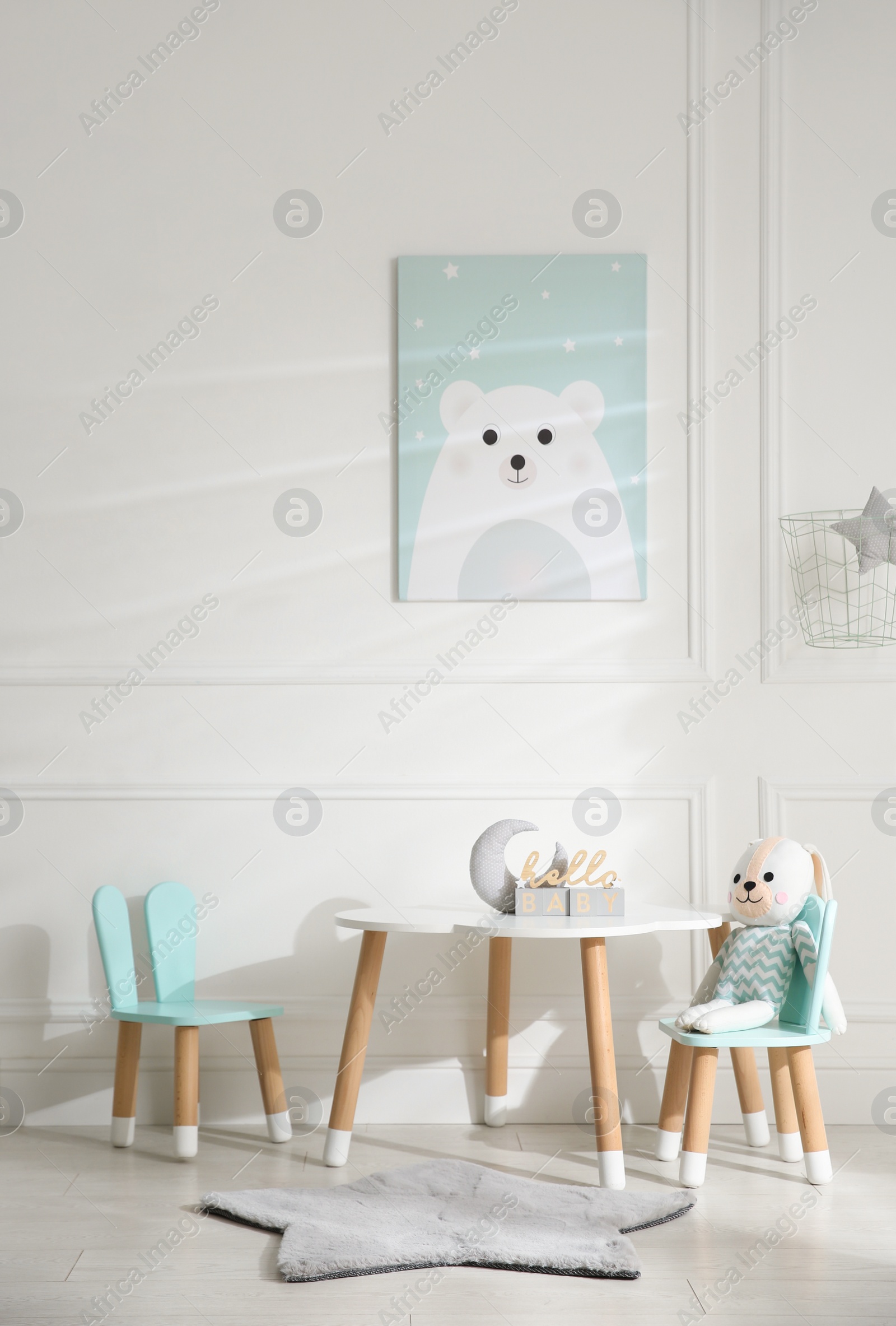 Photo of Baby room interior with stylish furniture and toys