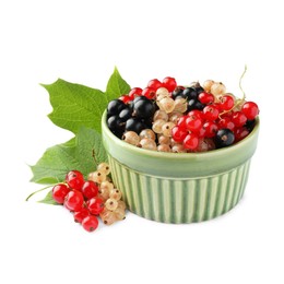 Photo of Fresh red, white and black currants in bowl with green leaf isolated on white
