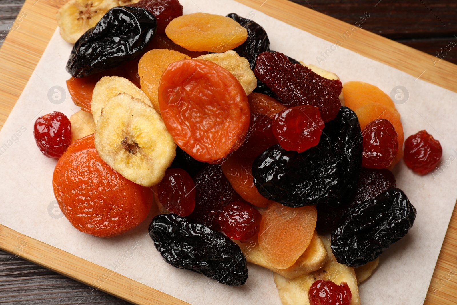 Photo of Mix of delicious dried fruits on table, closeup