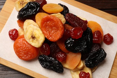 Photo of Mix of delicious dried fruits on table, closeup