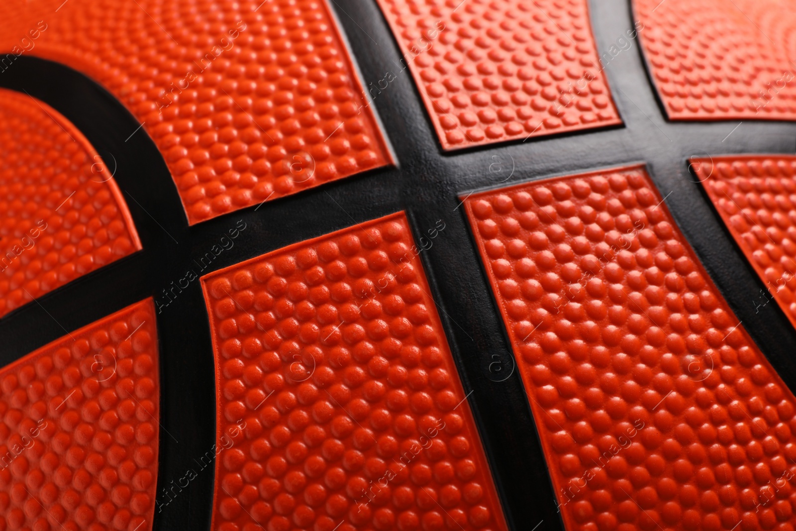 Photo of Orange basketball ball as background, closeup view