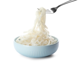 Photo of Taking rice noodles with fork from bowl on white background