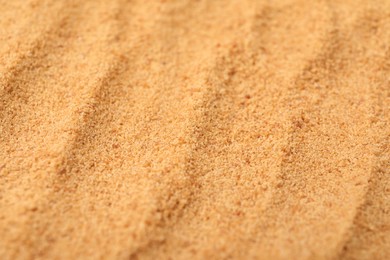 Photo of Brown coconut sugar as background, closeup view