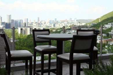 Photo of Chairs and table on terrace of cafe
