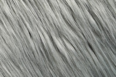 Photo of Texture of grey faux fur as background, closeup