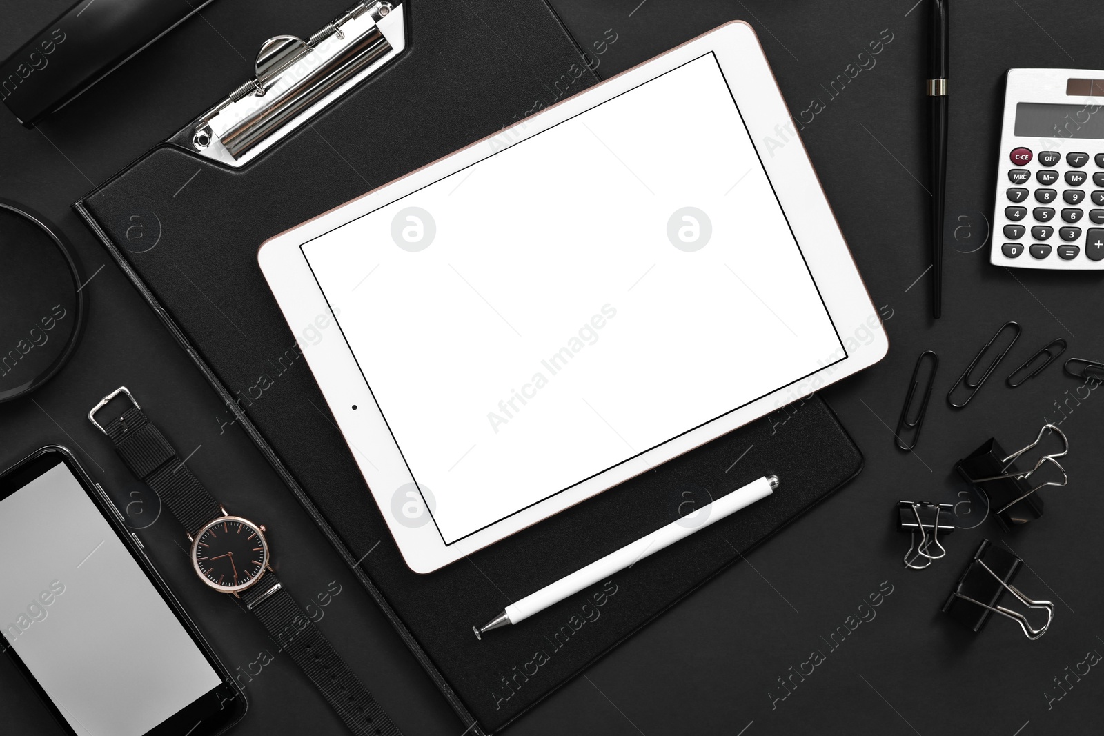 Photo of Flat lay composition with modern tablet on black background. Space for text