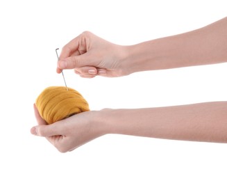 Photo of Woman needle felting from wool on white background, closeup