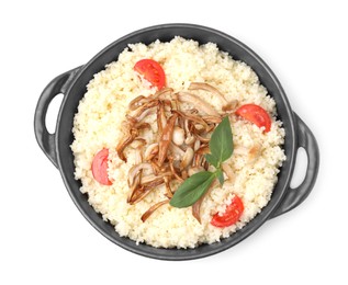 Photo of Frying pan of tasty couscous with mushrooms, basil and tomatoes on white background, top view