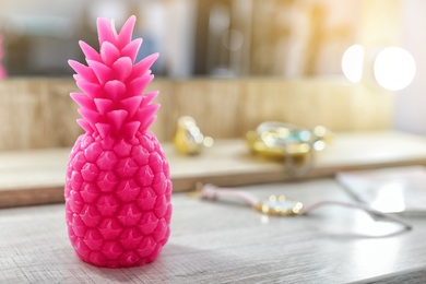 Photo of Pineapple shaped candle on table