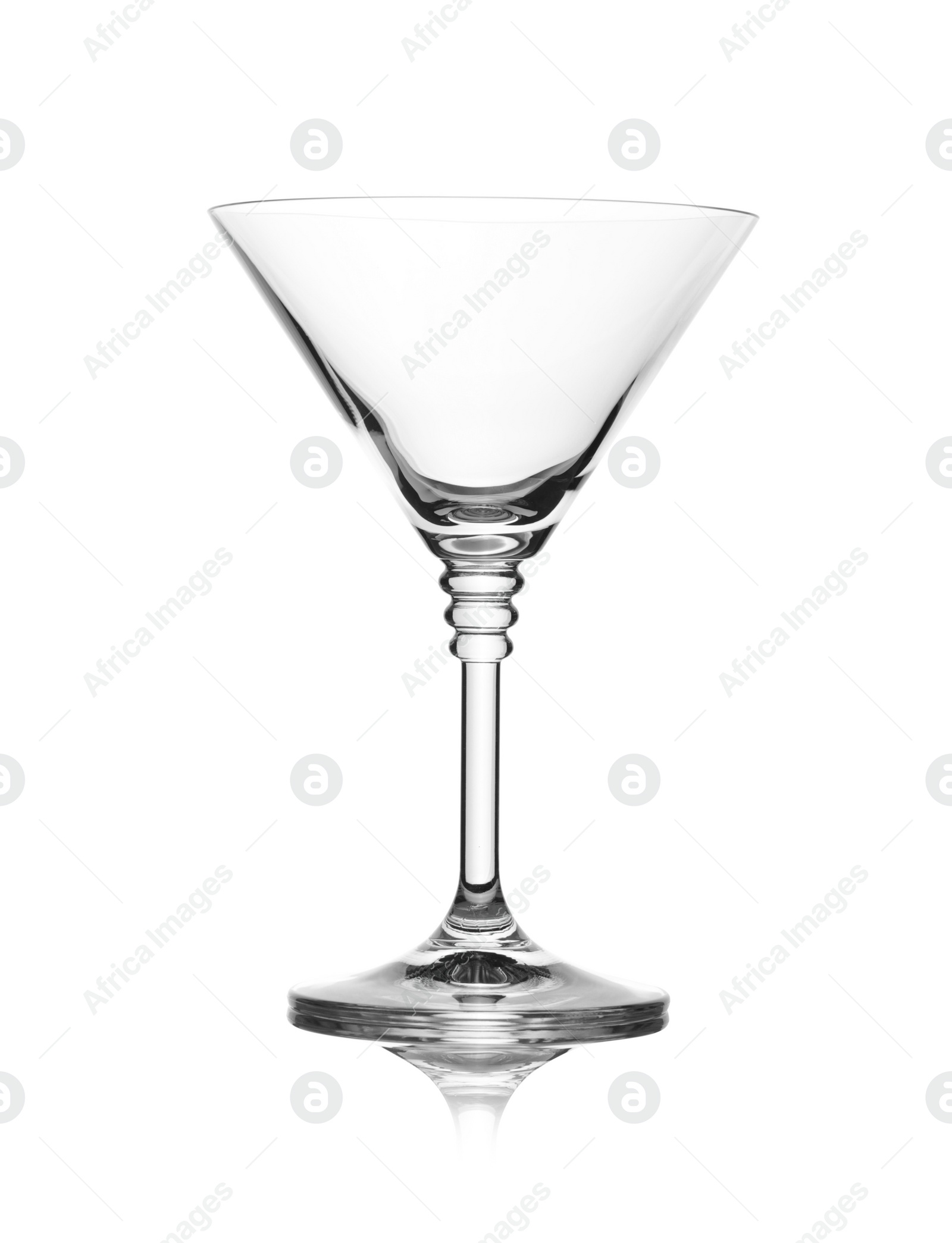 Photo of Empty crystal martini glass on white background