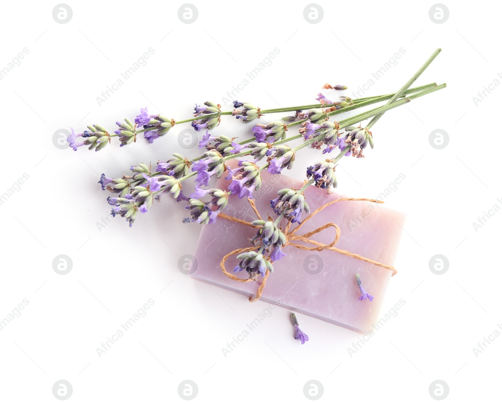 Photo of Hand made soap bar with lavender flowers on white background, top view