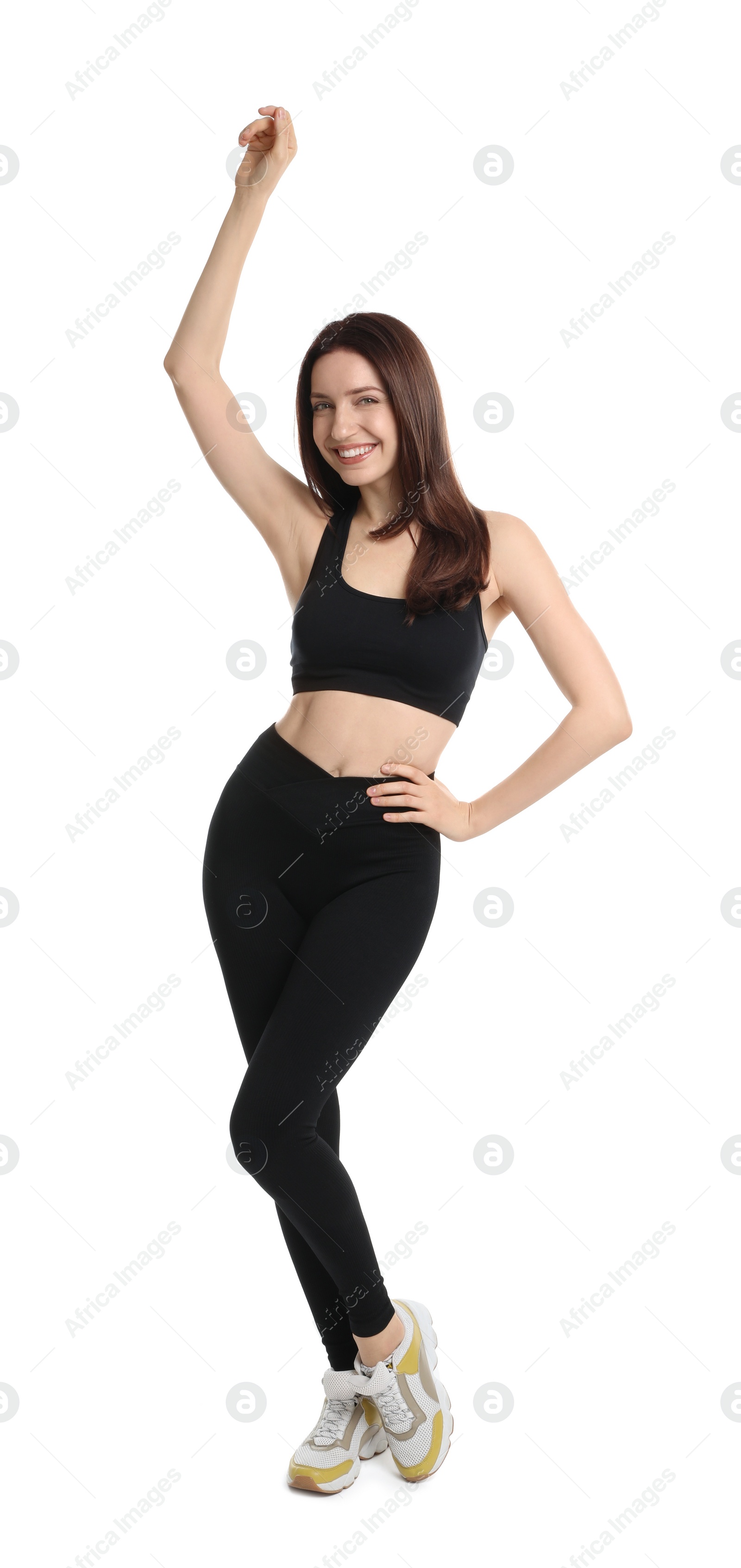 Photo of Happy young woman with slim body posing on white background