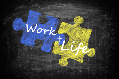 Work-life balance concept. Drawing of connected puzzle pieces on chalkboard