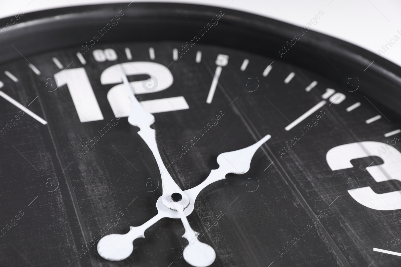 Photo of Stylish analog clock on white background, closeup