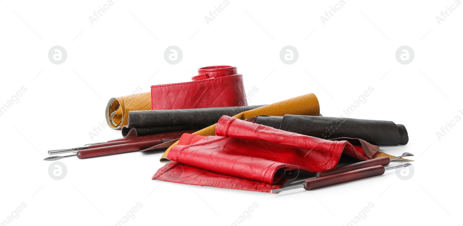 Photo of Leather samples and craftsman tools isolated on white